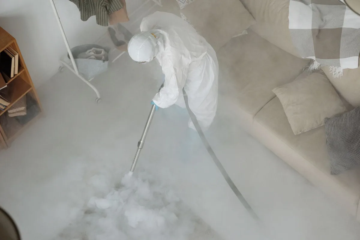Biohazard cleanup technician in protective equipment, Clawson, MI